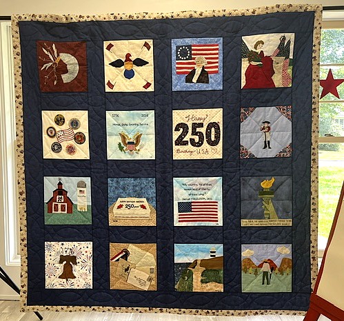 hand stitched patriotic quilt on display
